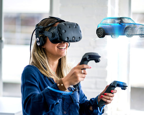 Young female wearing VR headset and visualizing a blue car