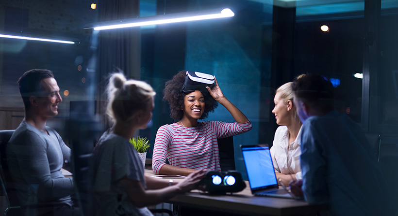 group of people talking about virtual reality in a meeting set up