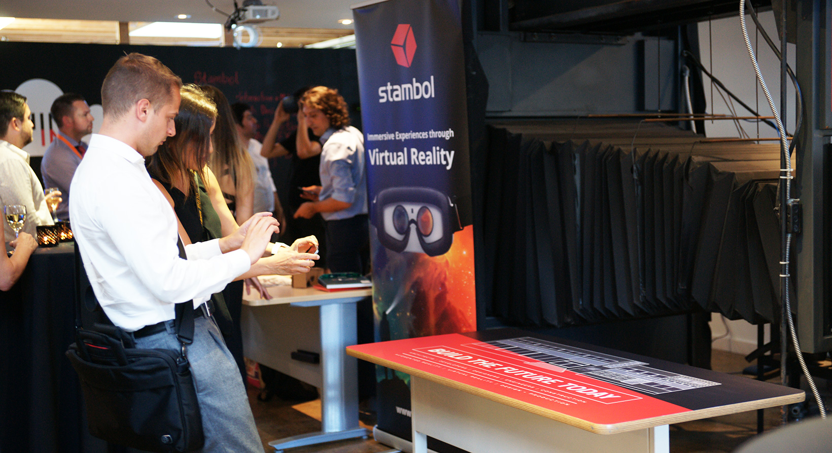 Young guest looking at Stambol Augmented Reality app