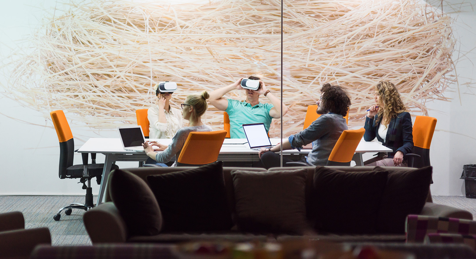 startup business team using virtual reality headset in a boardroom setup