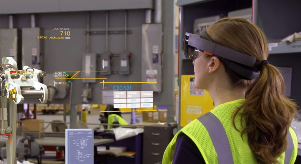female employee wearing microsoft hololens in a warehouse