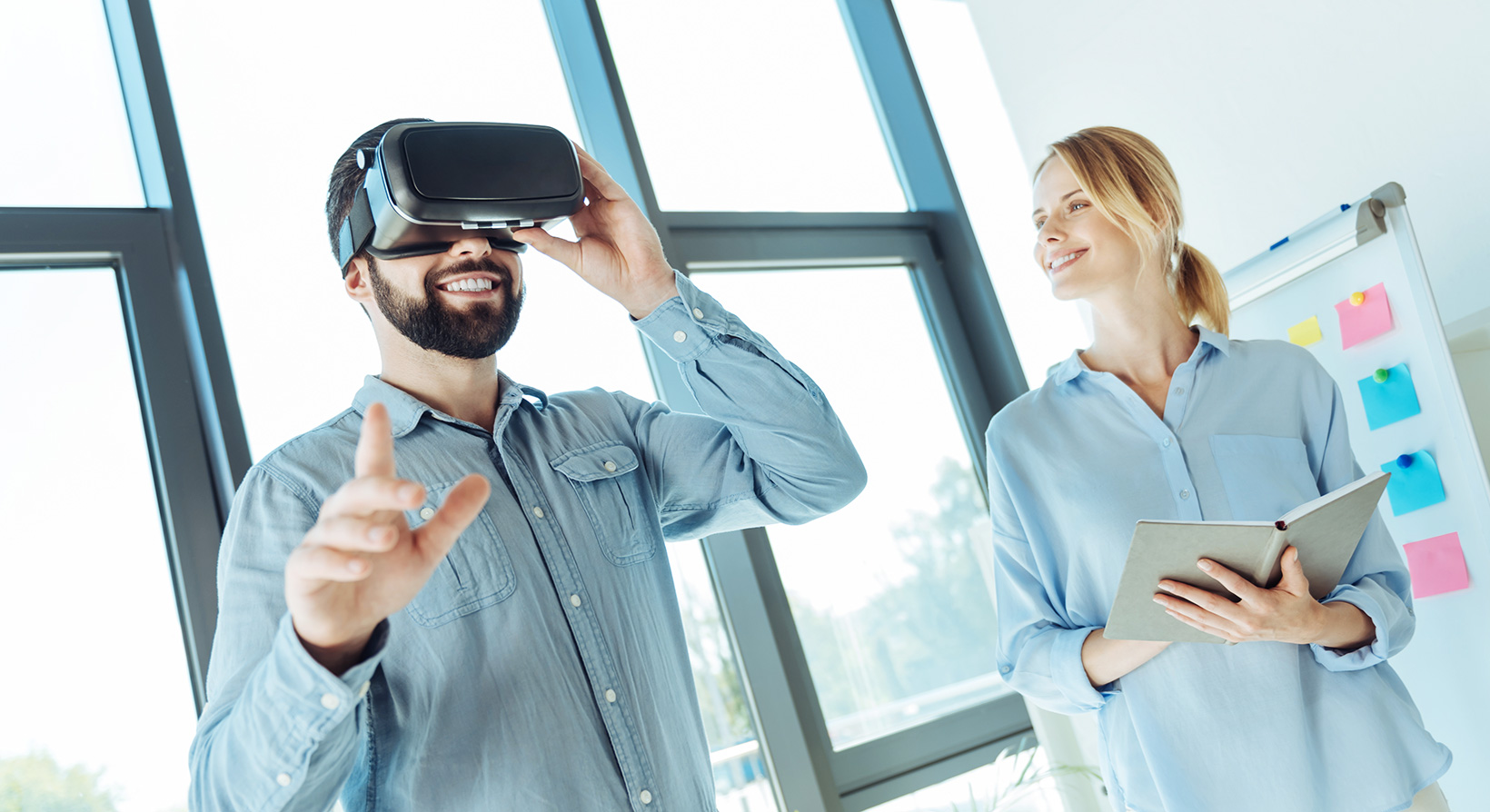 Young man trying out new VR headset in the office