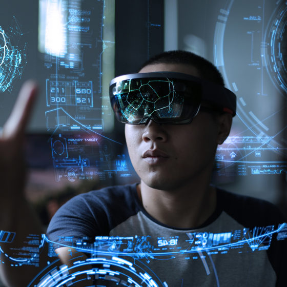 man wearing hololens and playing with a holographic object