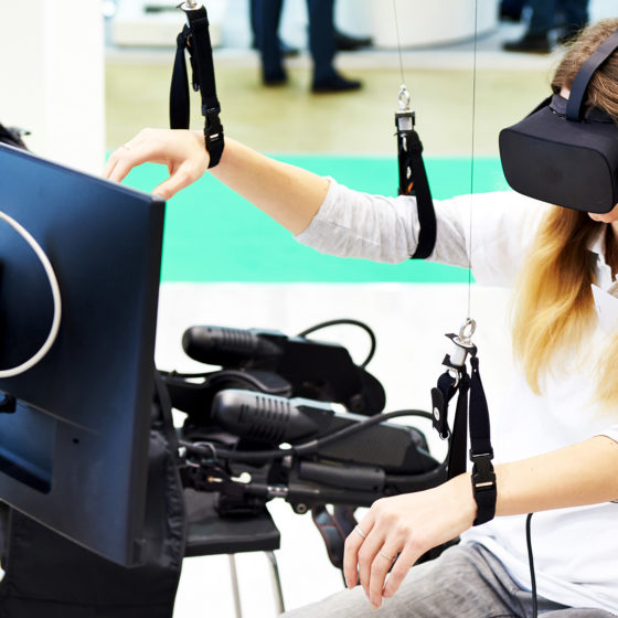 female patient is in virtual reality device for rehabilitation