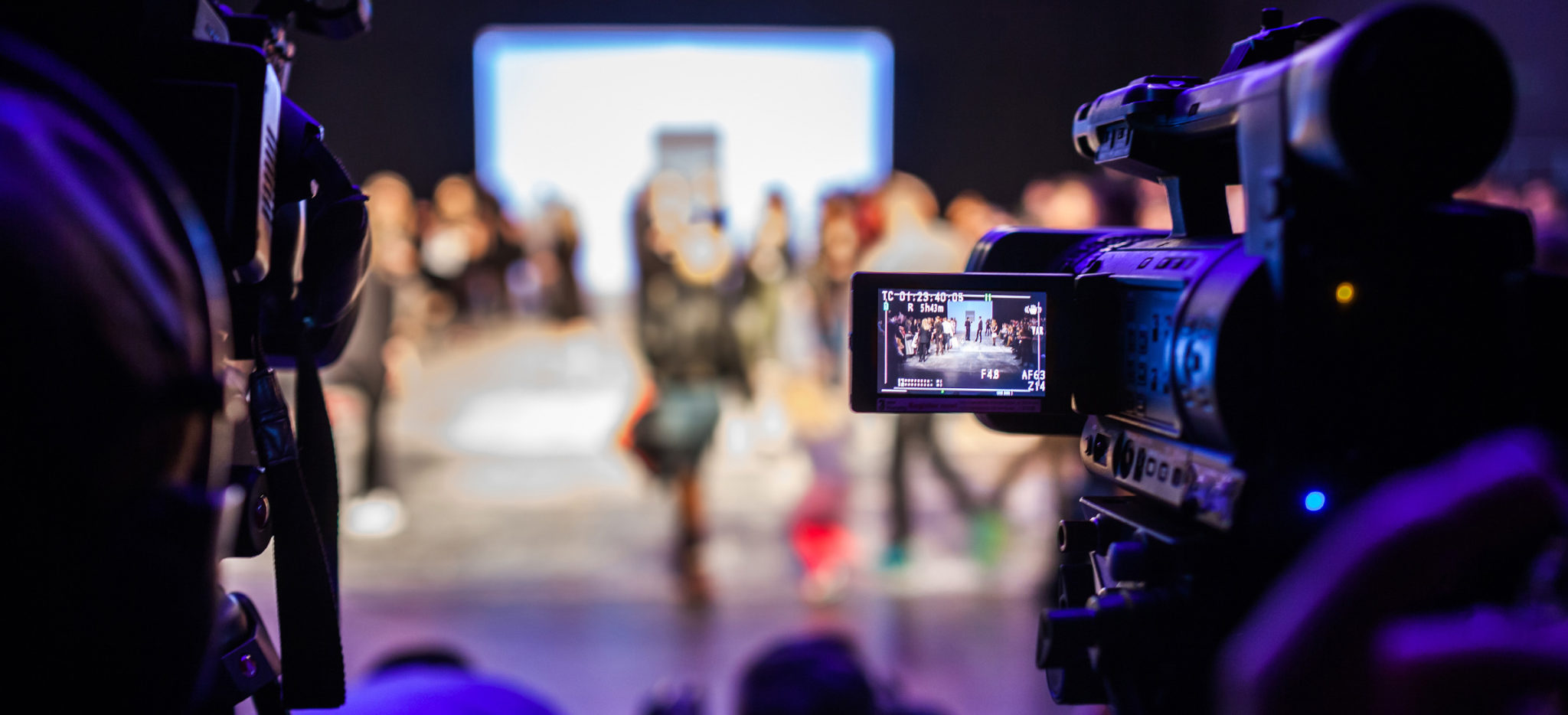 cameraman shooting fashion show for live broadcasting