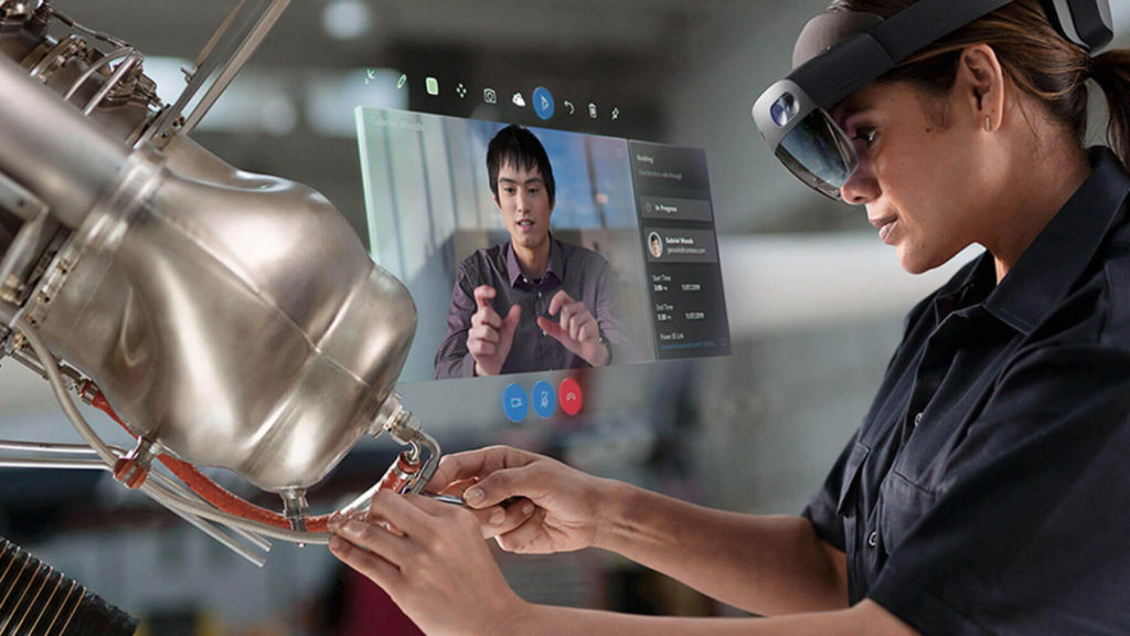 engineer using microsoft hololens for virtual training through remote assist