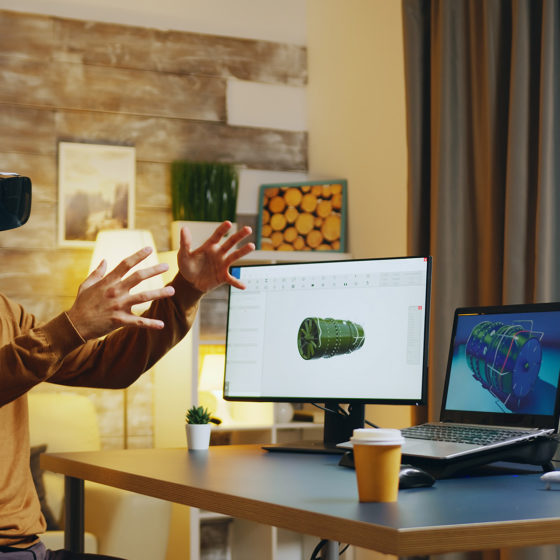Engineer using virtual reality headset for remote collaboration at his desk at home